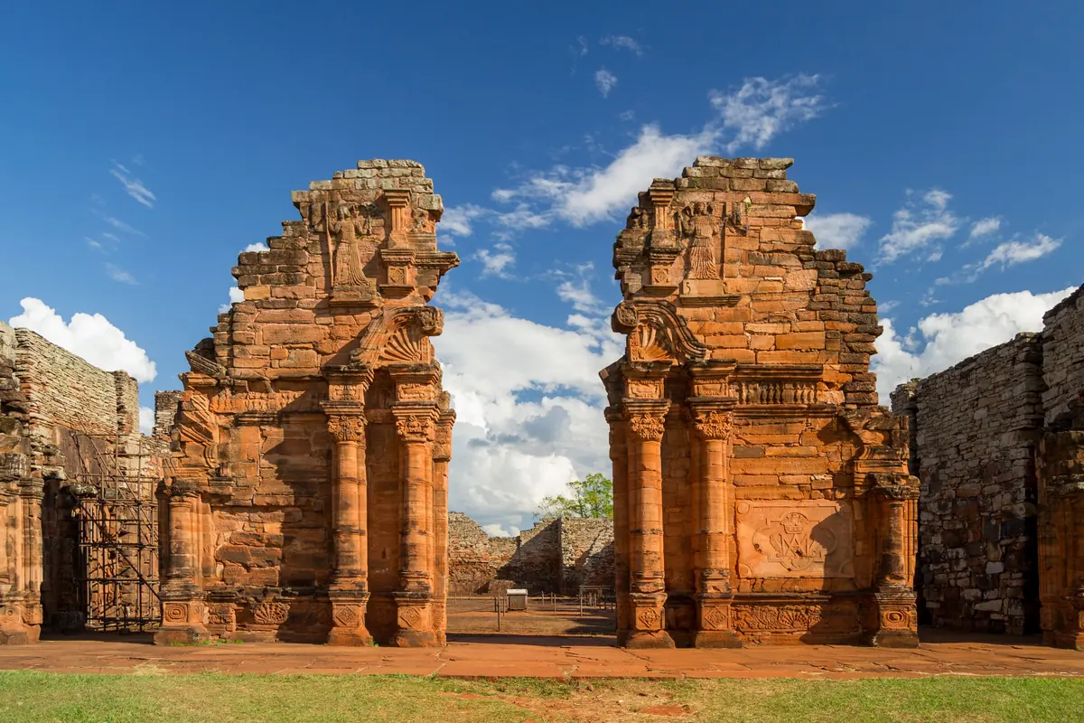 The red sandstone ruins of the Jesuit church at San Ignacio Miní in Misiones under a blue sky